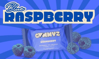Sealed blue Gummyz pouch labeled Blue Raspberry, surrounded by raspberries on a blue starburst background