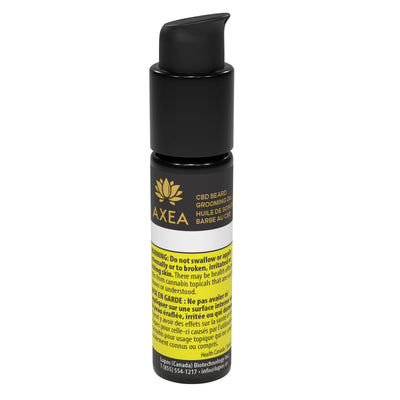 Black pump bottle of AXEA CBD Beard Grooming Oil with gold lotus logo, bilingual product name, and a yellow Health Canada warning label.