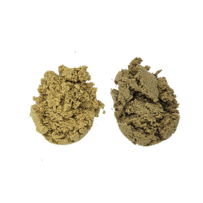 Two crumbly tan-green mounds of bubble hash side by side on a white background.