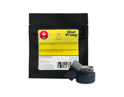 Black mylar bag labeled Next Friday G.A.S. Rosin beside an open black jar showing an amber rosin extract inside.