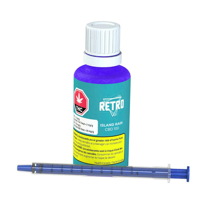 Teal bottle labeled RETRO Island Rain CBD 100 beside an oral dosing syringe filled with purple oil.