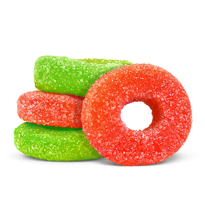 Sugar-coated red and green ring-shaped gummies stacked together on a black background.