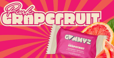 Pink Grapefruit graphic banner showing a wrapped Gummyz candy bar beside sliced grapefruit.