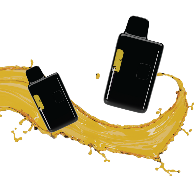 Two black all-in-one vape devices with yellow accent buttons, set against a splash of golden liquid.