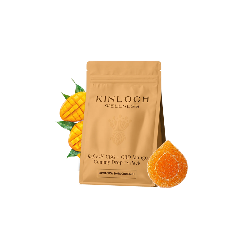 Tan Kinloch Wellness pouch for Refresh CBG + CBD Mango Gummy Drop 15 pack, with sliced mango halves and one orange teardrop-shaped gummy beside it.