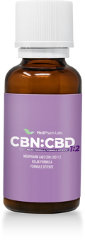 Amber glass tincture bottle with a white cap and purple label reading MediPharm Labs CBN:CBD 1:2 Relax Formula.