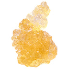 Close-up of a translucent amber cannabis concentrate chunk with a glassy, textured surface.