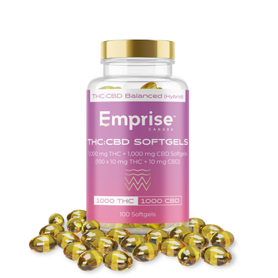 Pink Emprise Canada bottle labeled THC:CBD Softgels (100 count) surrounded by loose amber softgel capsules.