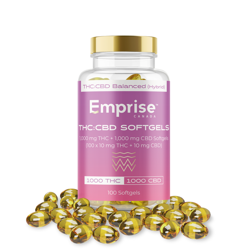 Pink Emprise Canada bottle labeled THC:CBD Softgels (100 count) surrounded by loose amber softgel capsules.