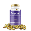 Clear bottle of Emprise Canada CBN + CBG softgels with gold cap and purple label, surrounded by loose amber gel capsules.