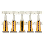 Strip of five 2112 - The Dream single-serve ampules filled with amber liquid, joined on a plastic sheet.