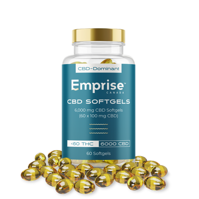 Amber glass jar of Emprise Canada CBD-Dominant softgels labeled 6,000 mg CBD (60 x 100 mg), surrounded by loose gold softgel capsules.