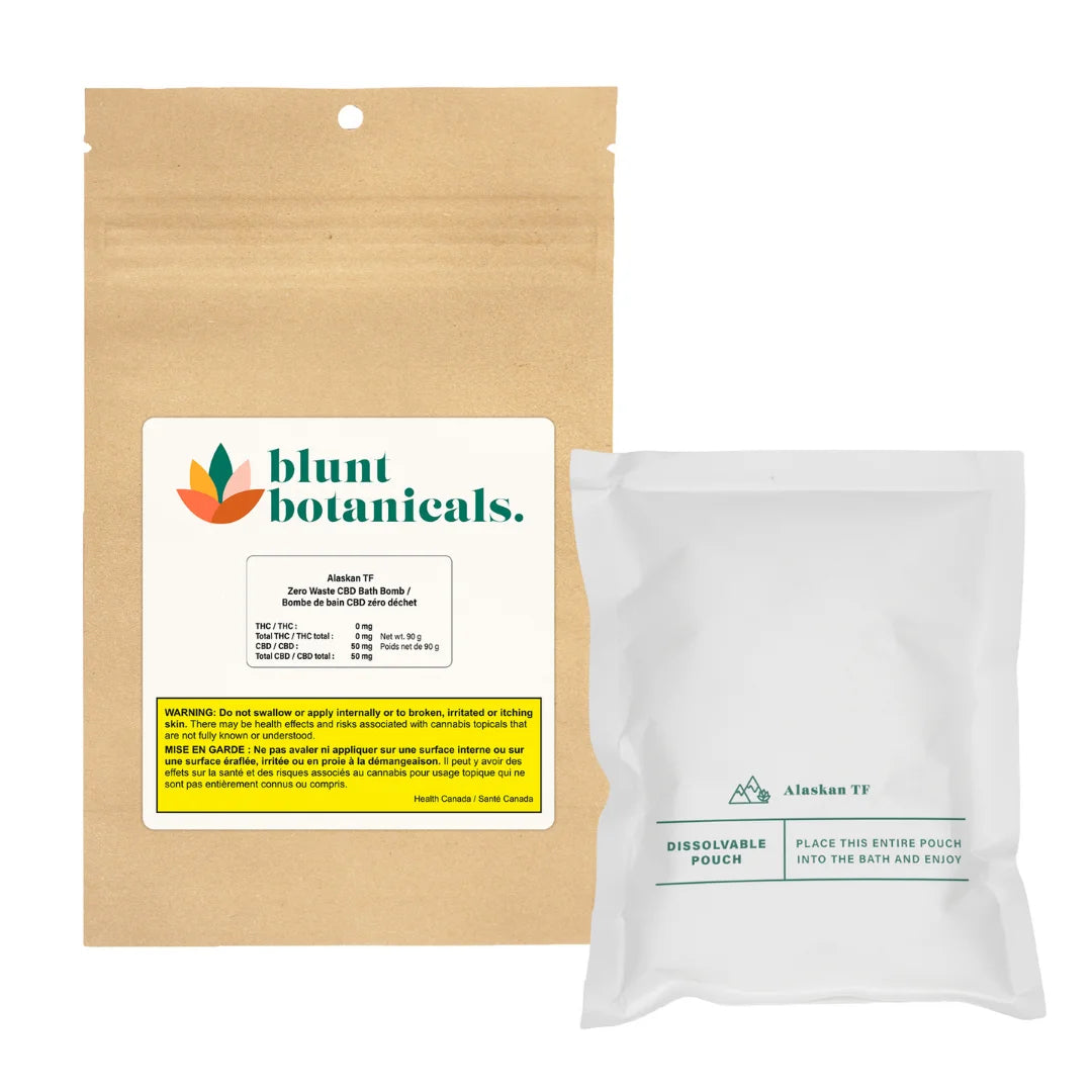 Kraft paper package for Blunt Botanicals Alaskan TF Zero Waste CBD Bath Bomb beside its white dissolvable inner pouch.