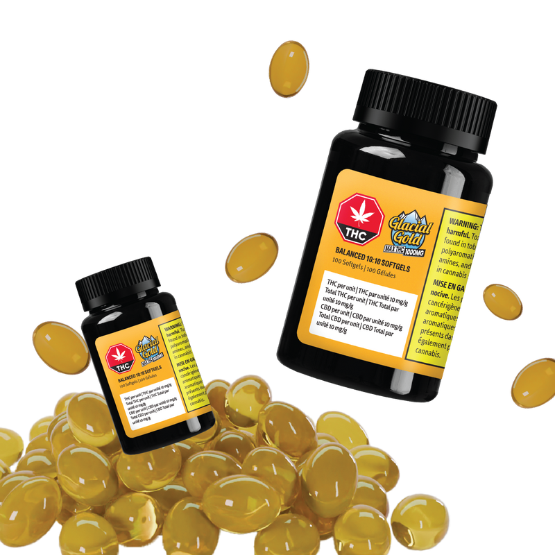 Two black Glacial Gold Balanced 10:10 Softgel bottles surrounded by loose amber softgel capsules