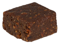 Close-up of a single dark chocolate-coated fruit bite square with a textured, fudge-like surface.