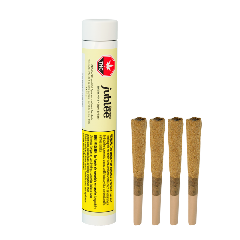 White tube labeled Jublee Extracts Bright Mind CBG Kief Dipped pre-rolls beside four kief-dipped pre-rolled joints.
