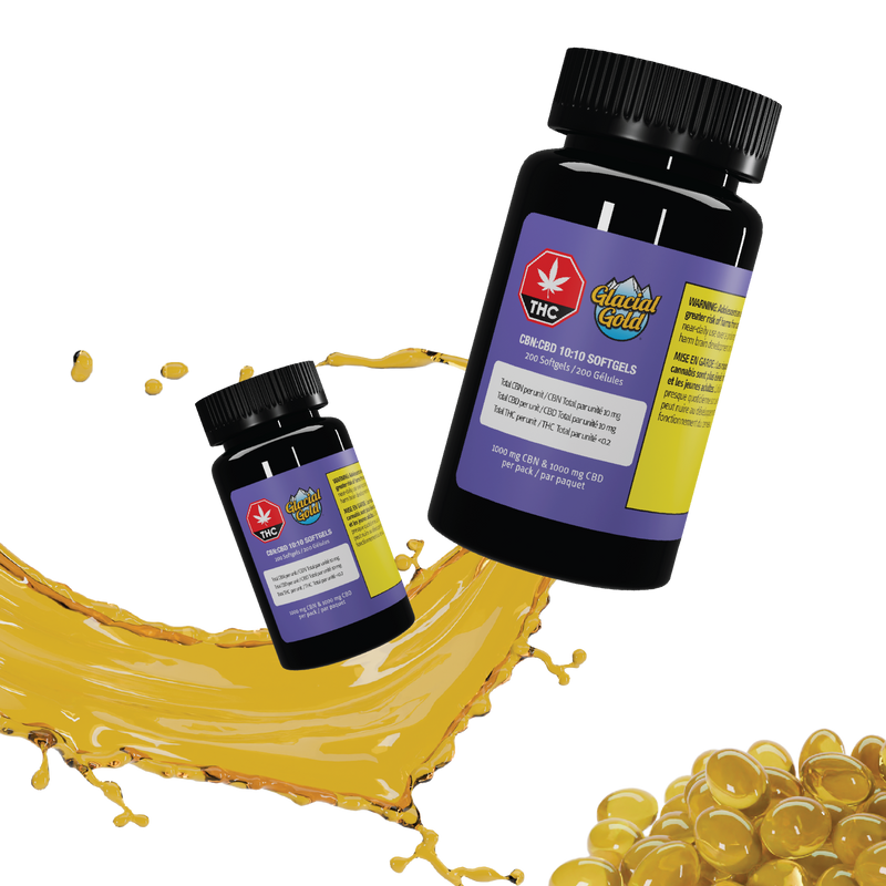Two dark Glacial Gold CBN:CBD 10:10 Softgels bottles tilted beside a splash of golden oil and loose amber softgel capsules.