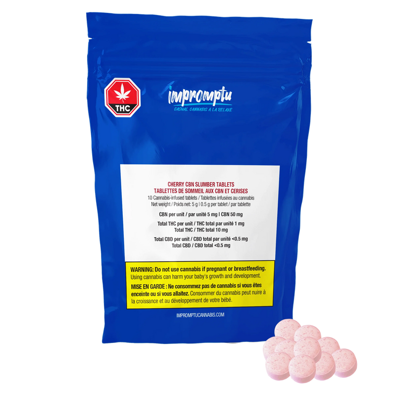 Blue Impromptu Cherry CBN Slumber Tablets pouch beside a pile of pink cannabis-infused tablets.