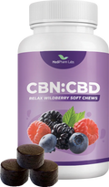 White bottle of MediPharm Labs CBN:CBD Relax Wildberry Soft Chews with a purple label showing berries, beside three dark round chews.