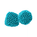 Two round, sugar-coated bright teal blue berry-shaped gummies.