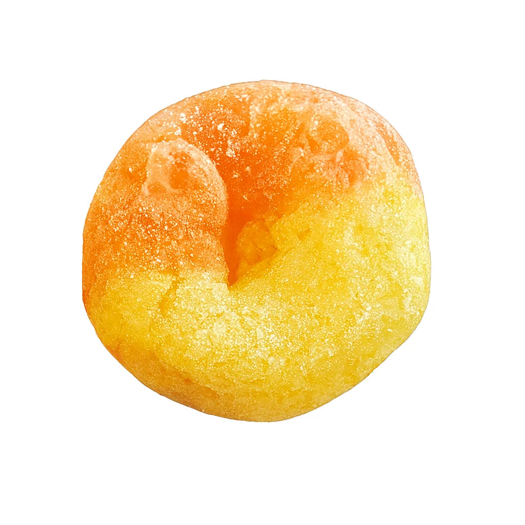 Single orange and yellow ring-shaped freeze-dried candy with a sugared, crumbly texture