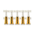 Five clear ampules of amber Gold Rush shatter oil connected on a perforated dosing strip.