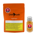 Orange Chili Kush packaging pouch for habanero hot sauce beside a small glass bottle of the orange sauce with a metal cap.