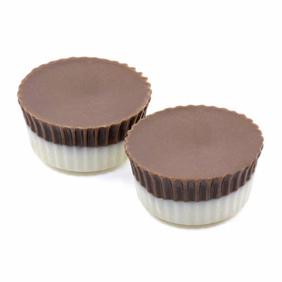 Two round hash rosin chocolate cups with milk chocolate tops and white chocolate bases