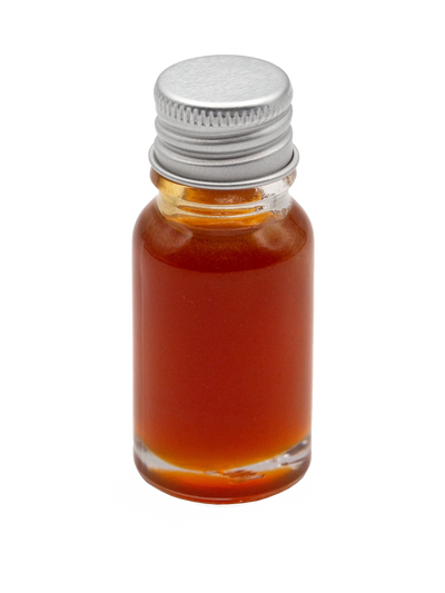 Small glass bottle with a silver screw cap containing amber-red Hot Honey infused oil.