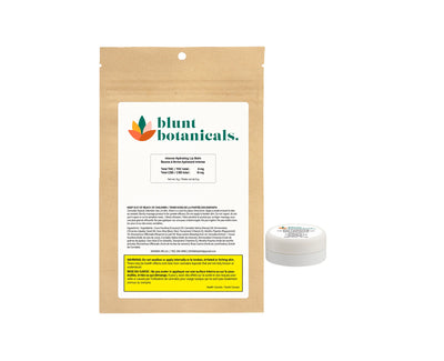 Kraft paper pouch printed with the Blunt Botanicals logo and Intense Hydrating Lip Balm label, next to the small white lip balm tin it contains.