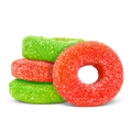 Sugar-coated red and green ring-shaped gummies stacked together on a black background.