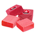 Pink taffy candy pieces, some individually wrapped in red foil stamped with a THC symbol, others unwrapped showing the soft taffy squares.