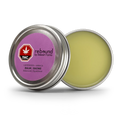 Open metal tin of Lavender + Arnica Rebound Balm by Stewart Farms, showing the pale yellow balm and purple lid label with THC symbol.