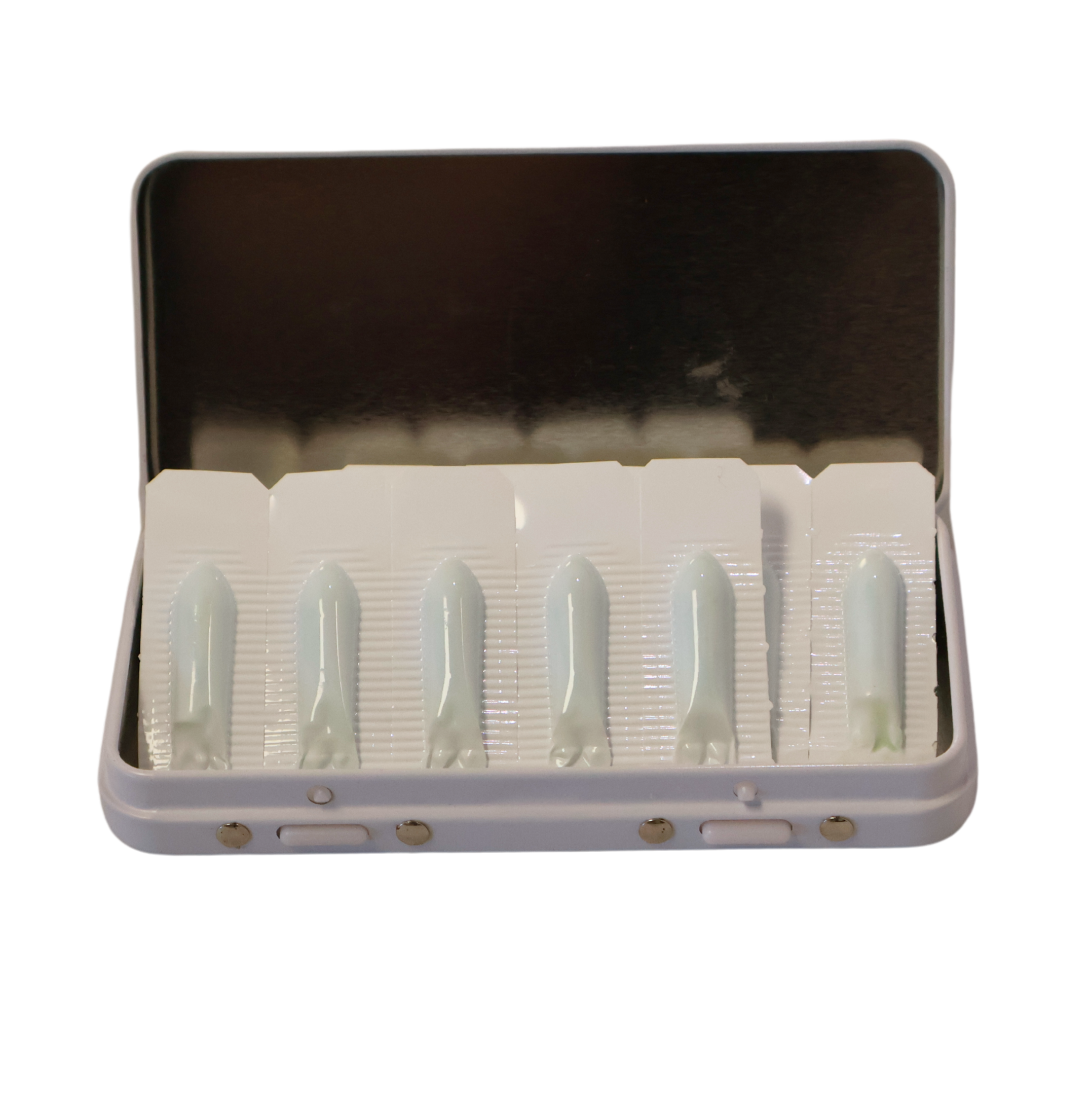 Open Medisenol case with mirrored lid, showing six foil-backed suppositories in individual blister pockets.
