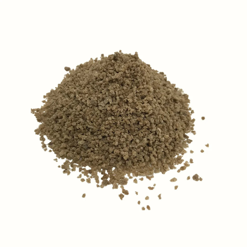 Loose pile of granular light brown MTL Sugar Hash concentrate.