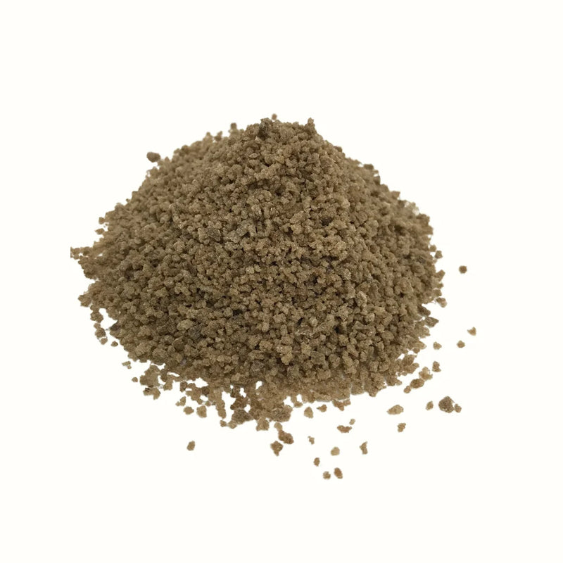 Loose pile of granular light brown MTL Sugar Hash concentrate.