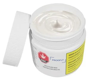 Open white tub of Proofly Muscle THC Body Cream showing the swirled white cream and product label on the container.