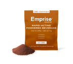 Copper-colored Emprise Rapid pouch for Over It Coffee CBD 20mg beside a pile of brown powdered beverage mix