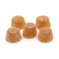 Five amber, sugar-coated Peach Chamomile Rest Gummies CBN arranged in a group.