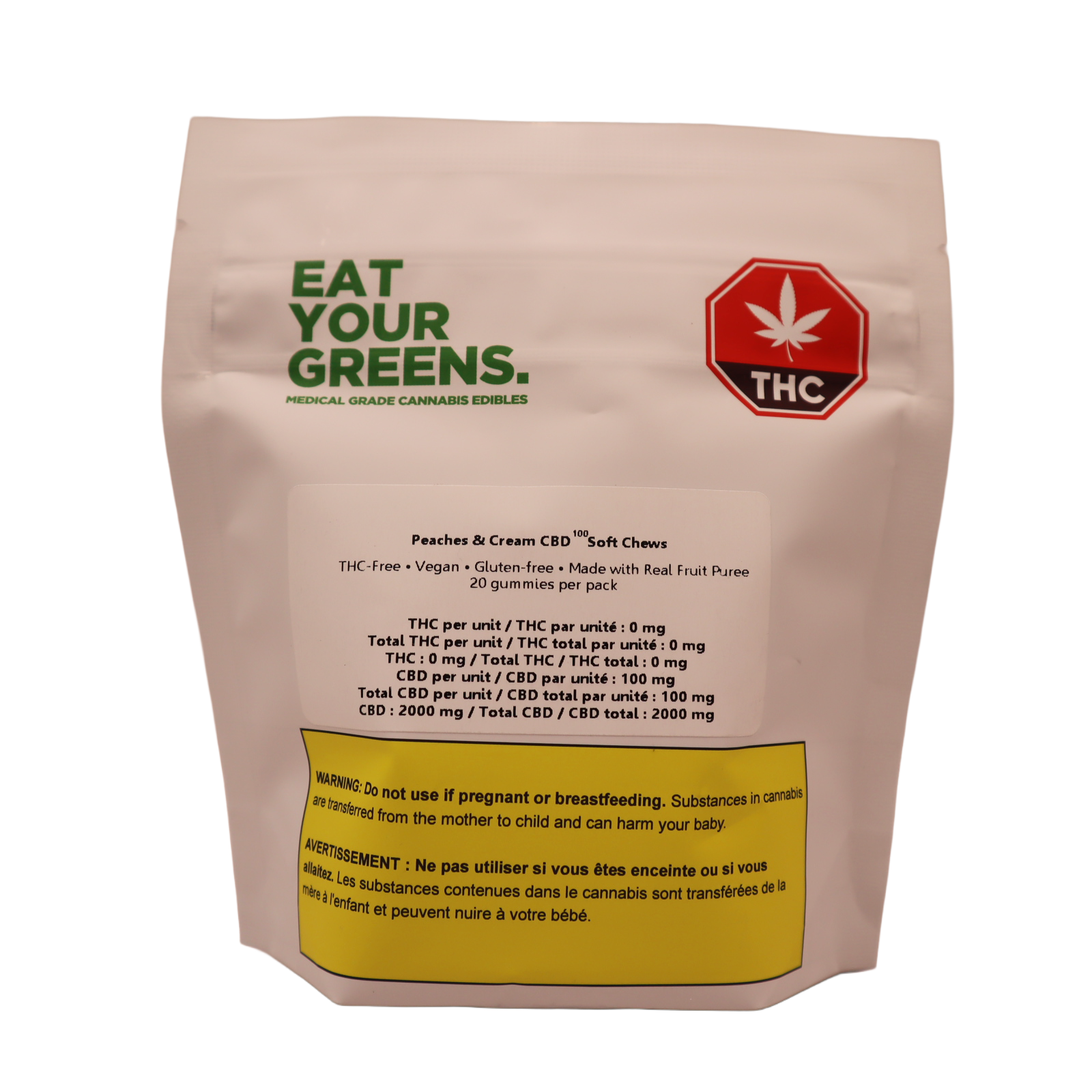 White stand-up pouch for Eat Your Greens Peaches & Cream CBD100 Soft Chews, labeled THC-free, vegan and gluten-free, with a THC symbol and warning text.