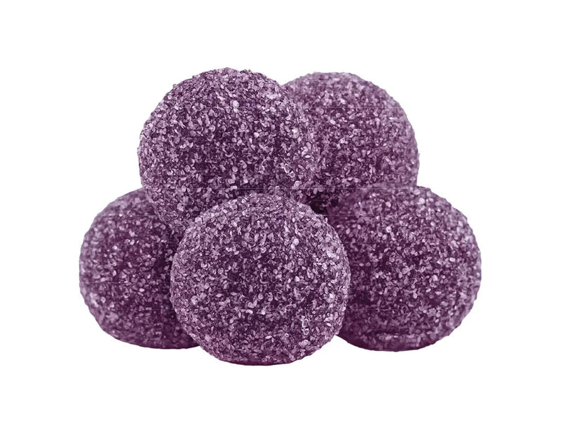 Five purple sugar-coated gummy pieces stacked together.