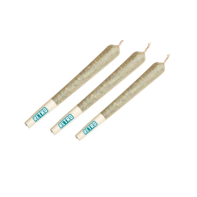 Three thin pre-rolled joints with white RETRO-branded filter tips arranged diagonally on a white background.