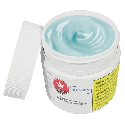 Open white jar of Proofly Sports 1:1 Cool Mint Gel showing pale blue-green gel inside, with the lid resting beside it.