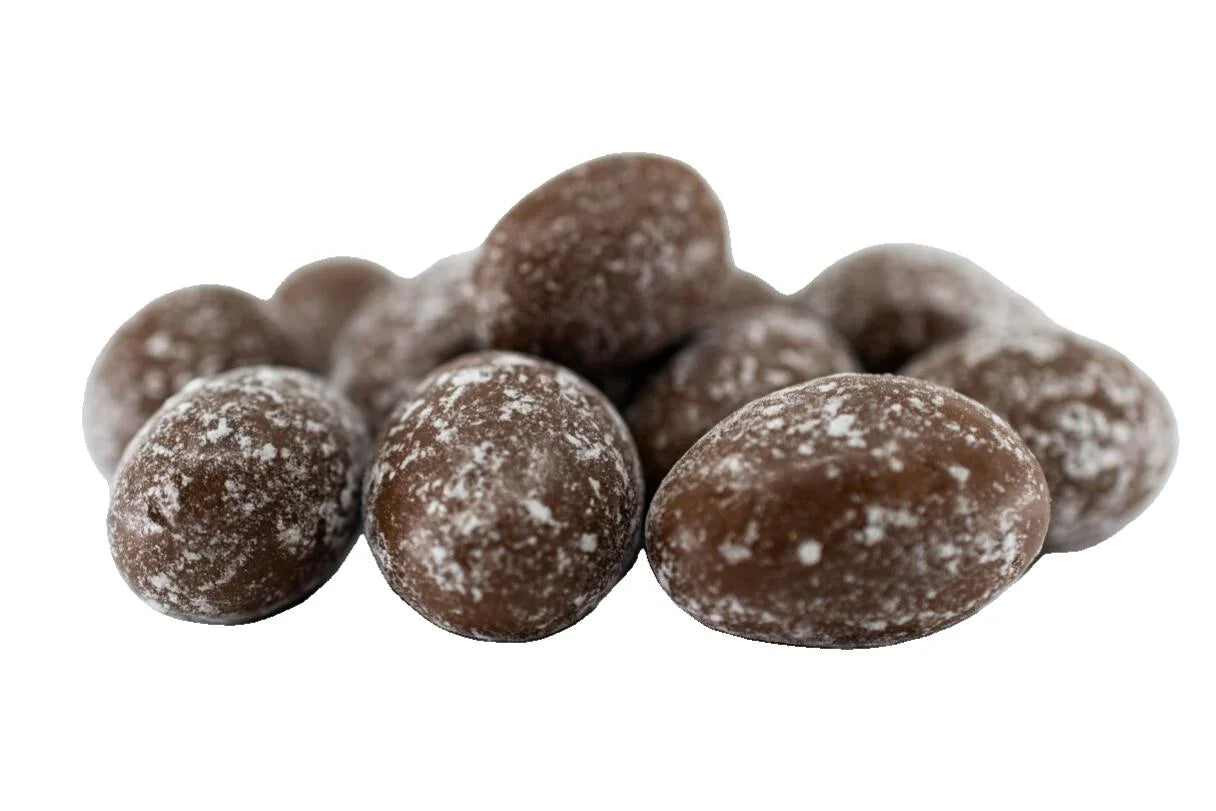 A pile of chocolate-coated almonds dusted with cocoa powder.